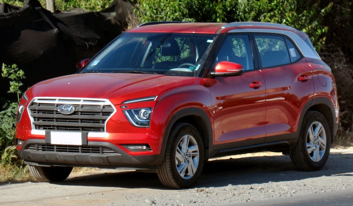 Creta vermelho representando 10 carros mais vendidos no Brasil.