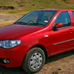 Fiat Palio 2007 na cor vermelha. Falando sobre luz vermelha no painel do palio 2007.
